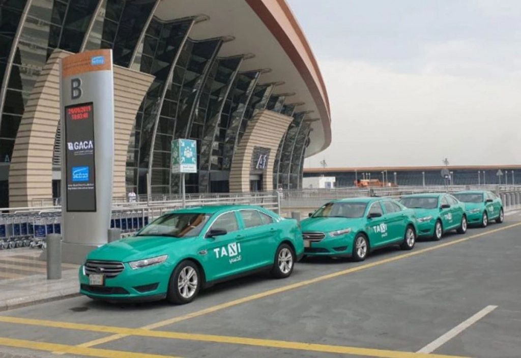 l1q9tUKV-Saudi-Green-taxis-airport.jpg