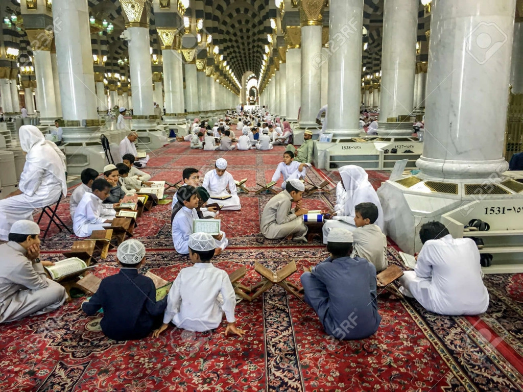 137374278-medina-saudi-arabia-june-25-muslim-children-learning-quran-or-koran-in-prophet-s-mosque-al.jpg