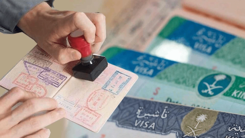 A-person-stamping-visa-on-a-passport-Credits-Connect-Resources.png